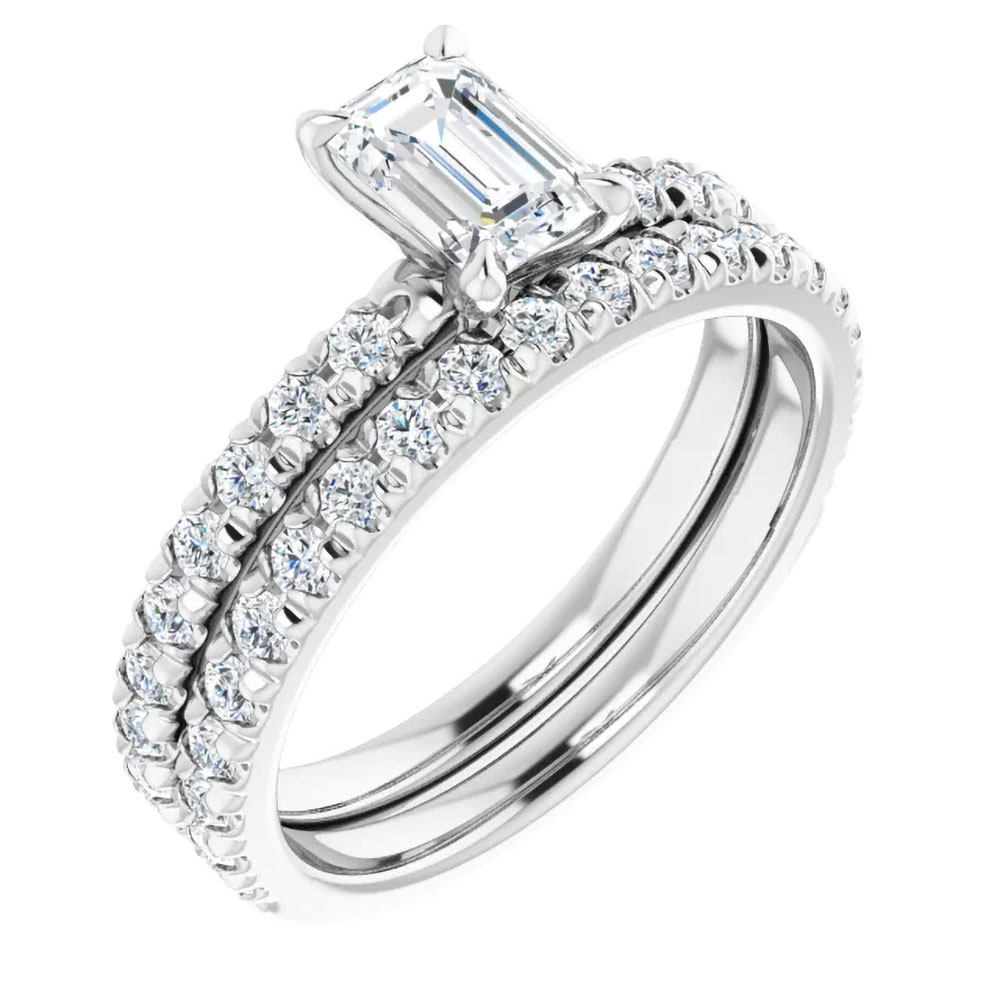 The elegance of a 0.70 carat emerald cut diamond ring alongside its matching bridal band; the promise of a shared future.