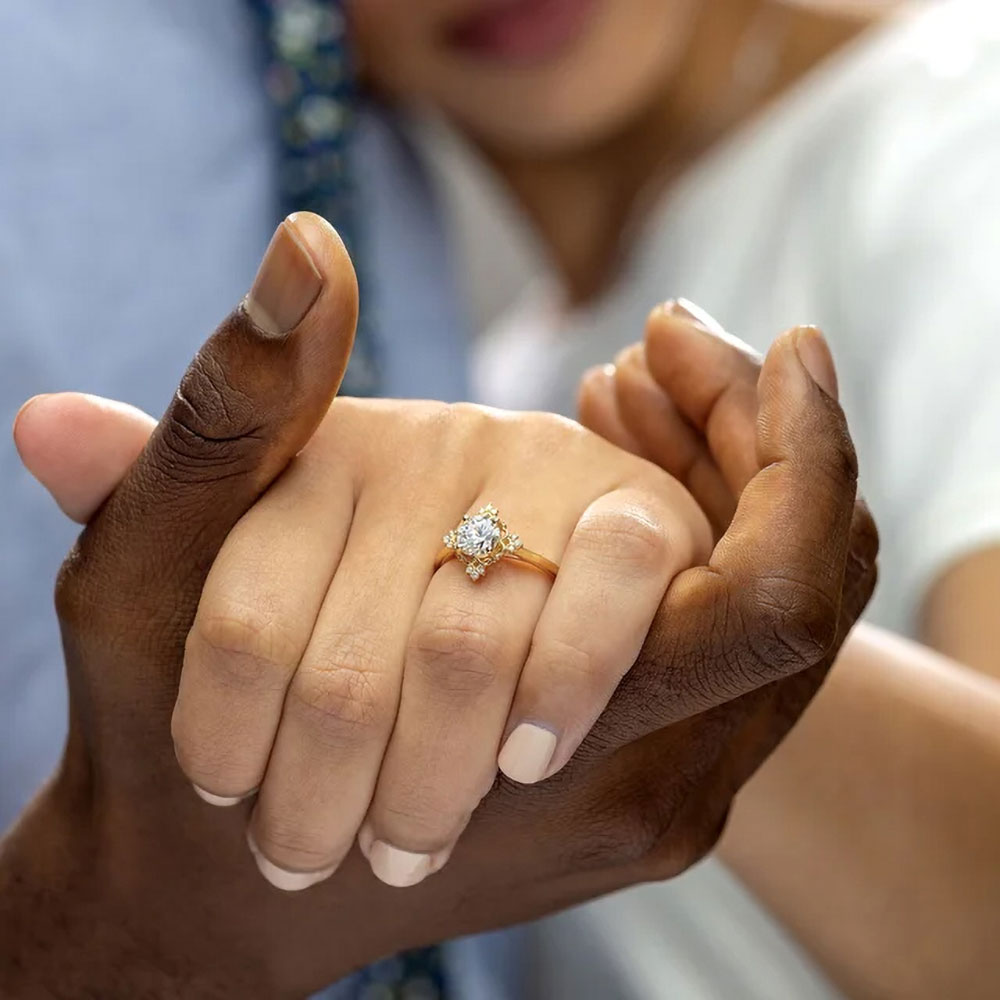 Capturing the moment of promise, this image showcases a 3/4 carat diamond engagement ring elegantly presented on a hand, its brilliance an echo of a future filled with light and love.