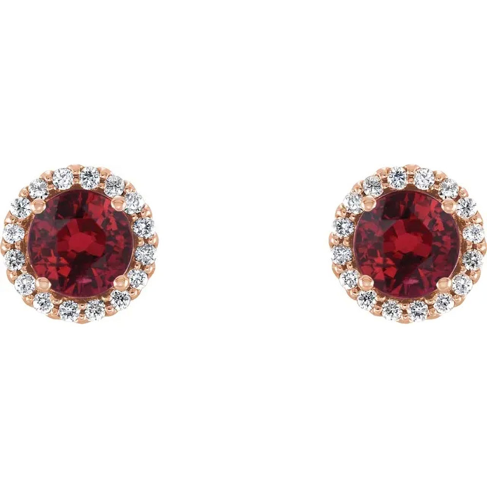 Crimson brilliance shines from these ruby earrings, wrapped in a 14K gold diamond halo for unmatched elegance.