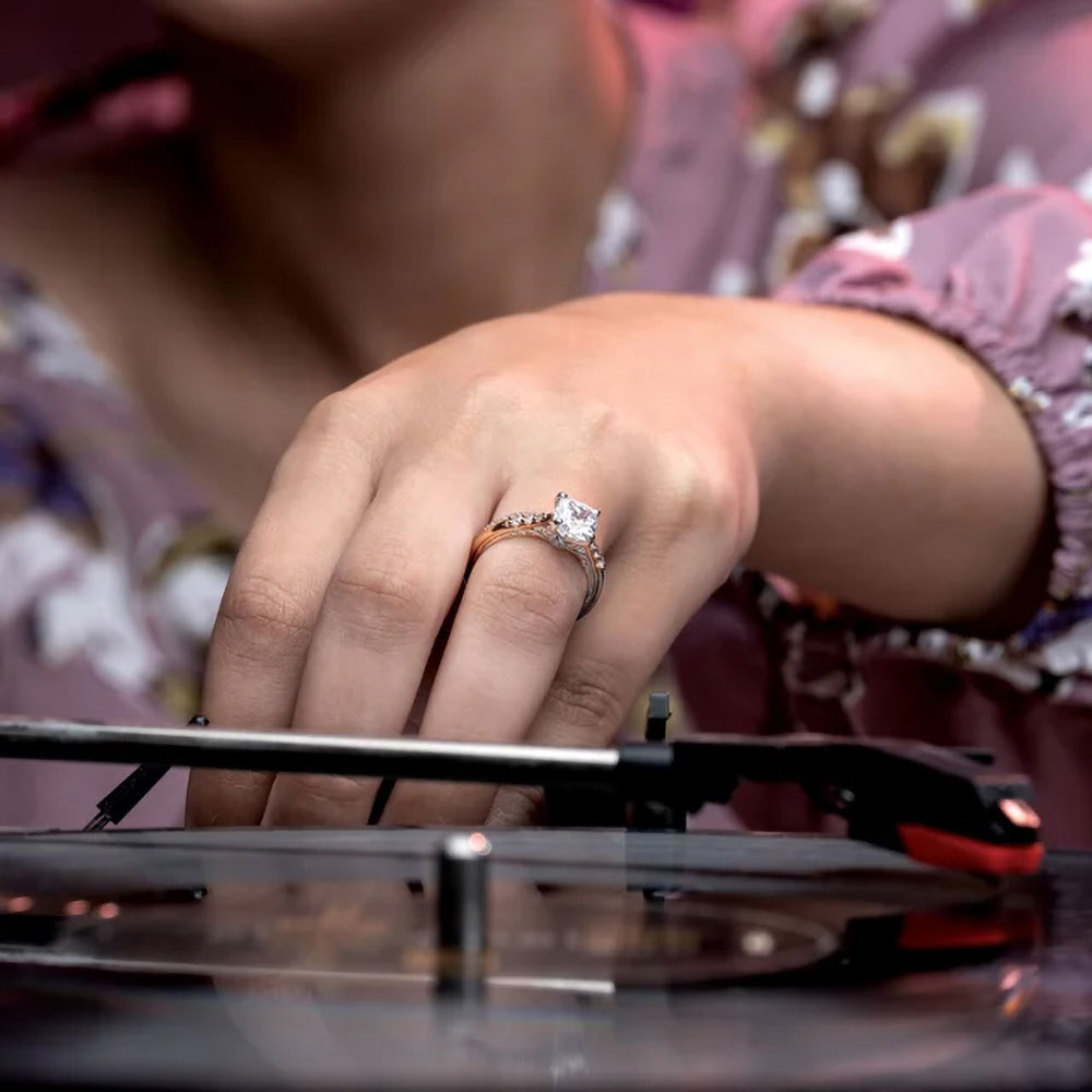 The modern symbol of love: An asscher cut lab-created diamond engagement ring, its brilliance accented by surrounding diamonds.