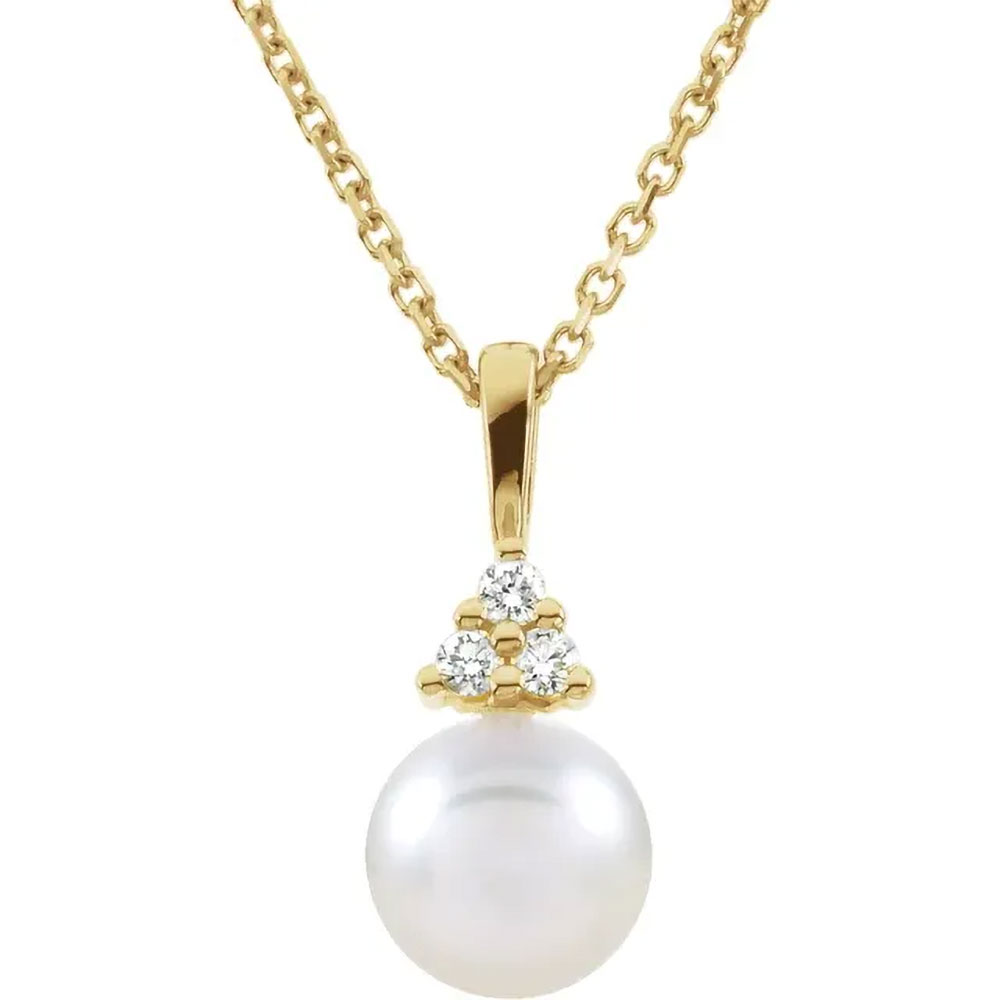 A product image of a pearl necklace with diamonds in 14k yellow gold.