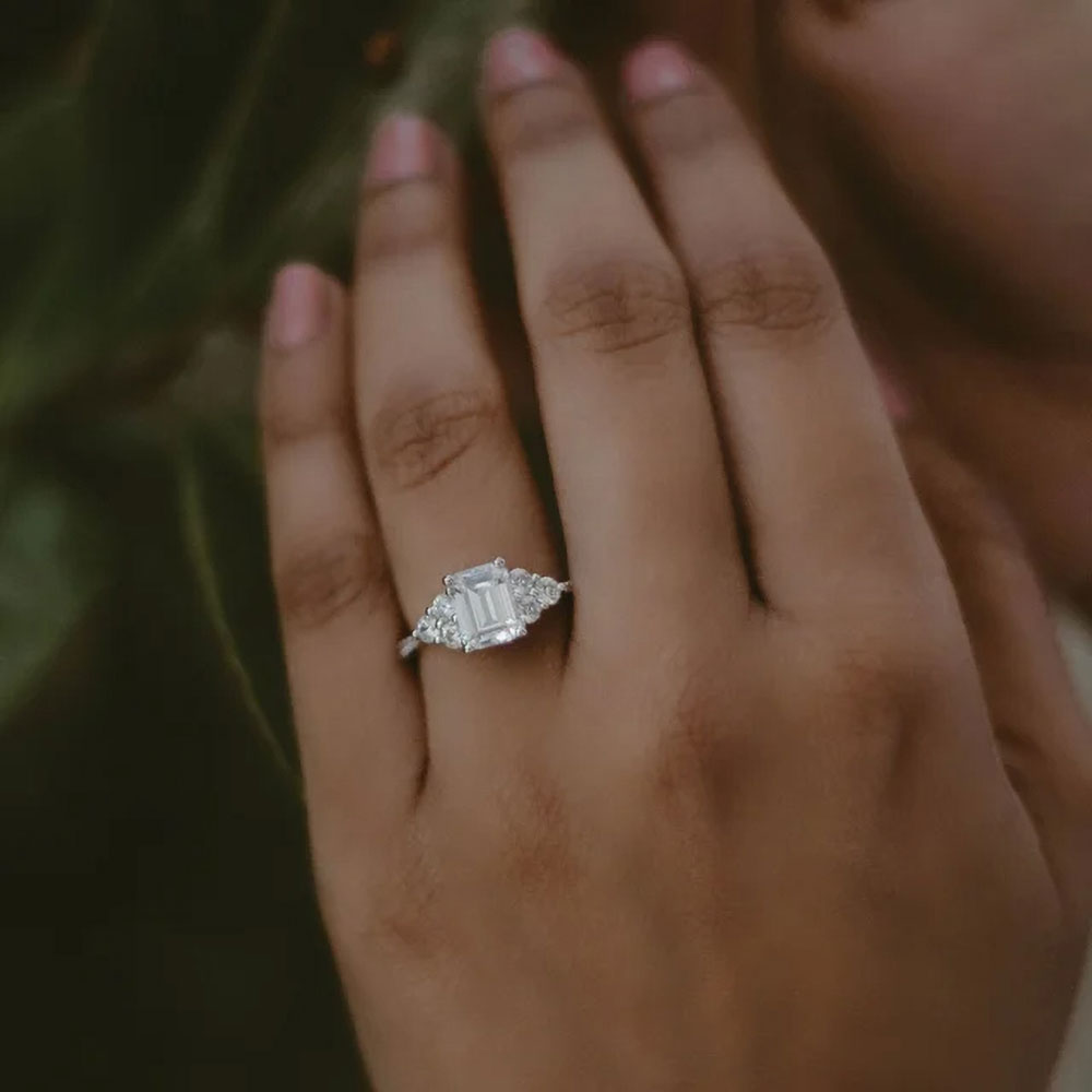 Pure elegance captured in the fire of a radiant cut moissanite engagement ring, a beacon of enduring love.