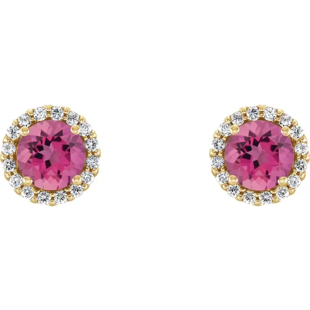 Rosy pink tourmaline set in 14K gold earrings, their brilliance accented by the subtle glow of diamonds.