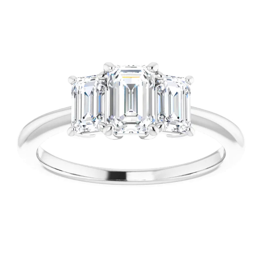 The epitome of grace: A three stone emerald cut diamond ring, each stone reflecting a chapter of the journey.