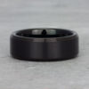 Top view of our beveled edge black tungsten ring, highlighting its polished finish and precision-cut angles for a modern, sharp aesthetic.