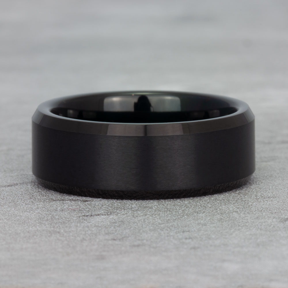 Top view of our beveled edge black tungsten ring, highlighting its polished finish and precision-cut angles for a modern, sharp aesthetic.