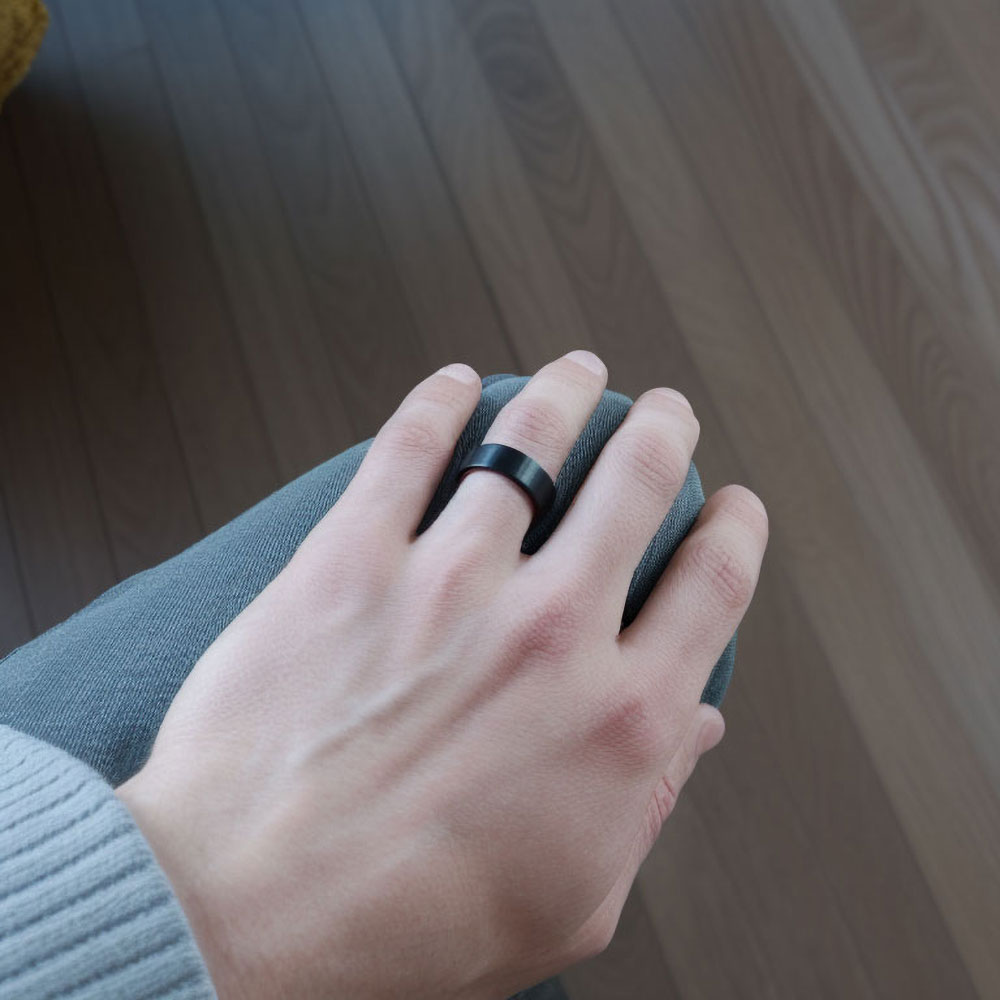 Lifestyle image of our versatile black and gold tungsten band, capturing its adaptability and elegance in everyday wear.