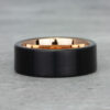 Close-up of our elegant black tungsten and gold band, highlighting the fine craftsmanship and sleek, modern aesthetics.