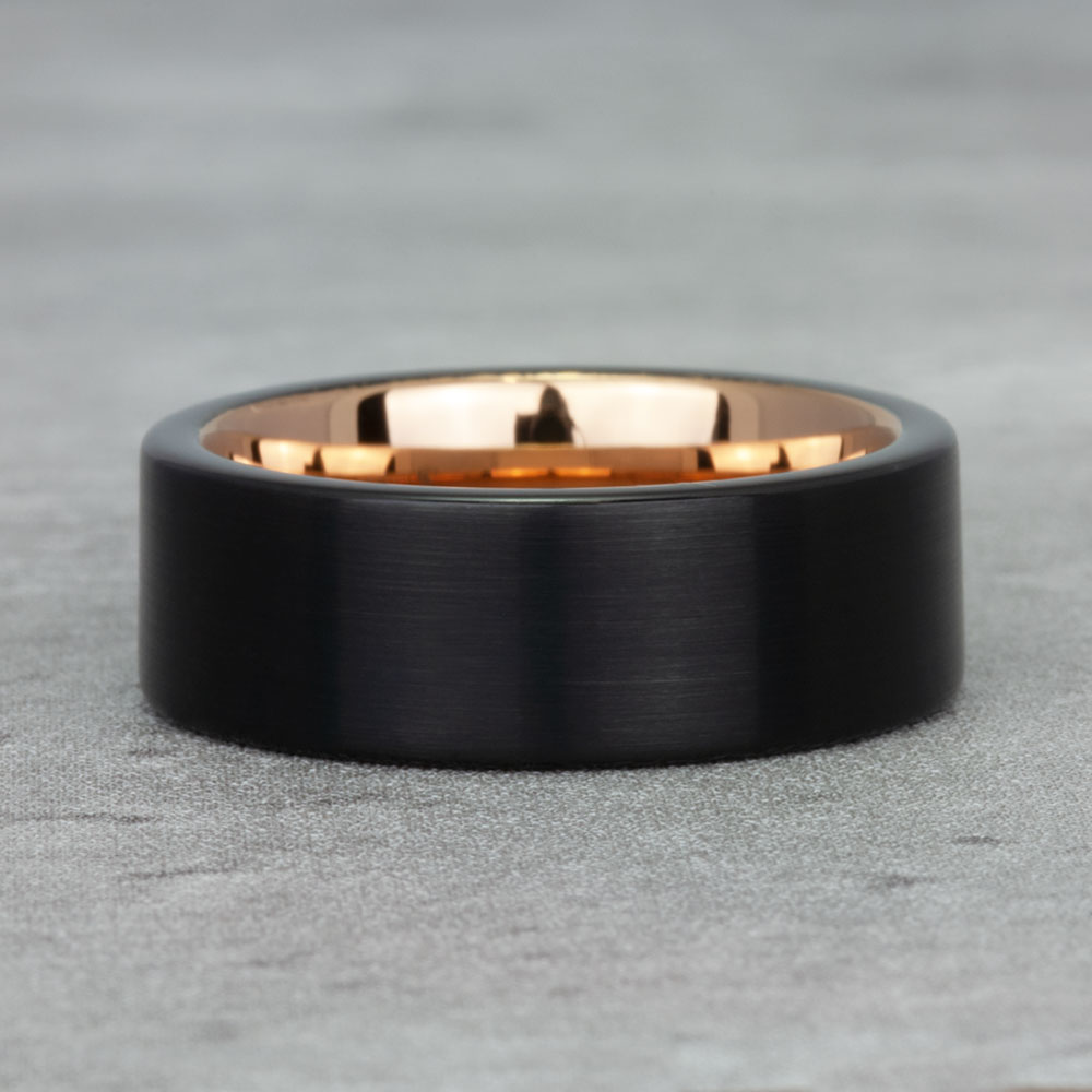 Close-up of our elegant black tungsten and gold band, highlighting the fine craftsmanship and sleek, modern aesthetics.