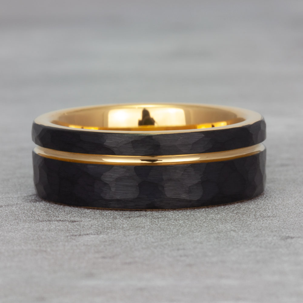 Close-up view of our black tungsten & 18k gold wedding band, showcasing the seamless blend of contemporary design and classic style.