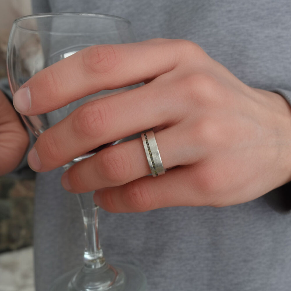 Image of a hand model displaying our silver and rough diamond ring, highlighting its unique design.