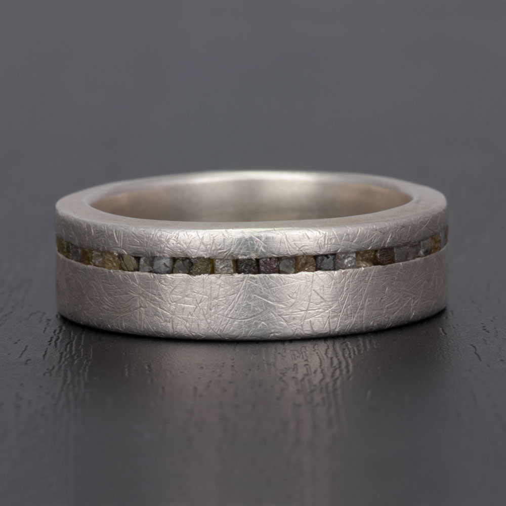 Profile view of our silver and rough diamond ring, illustrating the harmonious interplay of silver and rough diamonds.